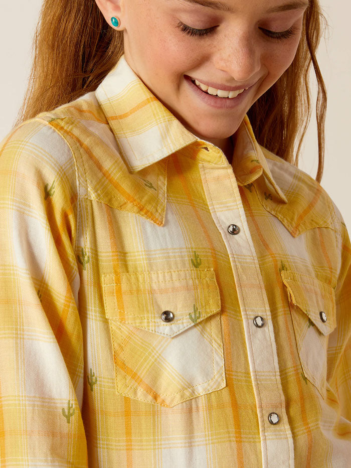 Ariat 10048597 Kids Long Sleeve Plaid Shirt Cactus Dobby front view. If you need any assistance with this item or the purchase of this item please call us at five six one seven four eight eight eight zero one Monday through Saturday 10:00a.m EST to 8:00 p.m EST
