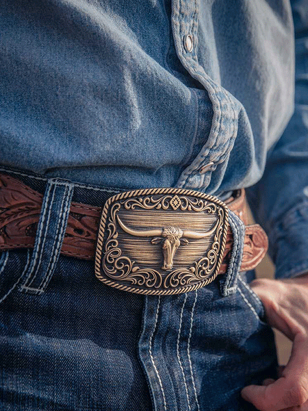Montana Silversmiths A973C Longhorn Legend Heritage Attitude Buckle Bronze front view on model. If you need any assistance with this item or the purchase of this item please call us at five six one seven four eight eight eight zero one Monday through Saturday 10:00a.m EST to 8:00 p.m EST