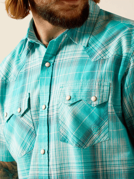 Ariat 10048498 Mens Haddon Retro Fit Short Sleeve Shirt Winter Aqua close up view of front pockets. If you need any assistance with this item or the purchase of this item please call us at five six one seven four eight eight eight zero one Monday through Saturday 10:00a.m EST to 8:00 p.m EST