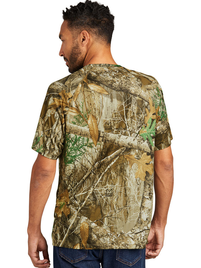 Russell Outdoors RU150 Mens Performance Short Sleeve Tee Realtree Edge front view. If you need any assistance with this item or the purchase of this item please call us at five six one seven four eight eight eight zero one Monday through Saturday 10:00a.m EST to 8:00 p.m EST