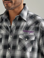 Wrangler 112327777 Mens Logo Long Sleeve Snap Plaid Shirt Black White Buffalo front close up view. If you need any assistance with this item or the purchase of this item please call us at five six one seven four eight eight eight zero one Monday through Saturday 10:00a.m EST to 8:00 p.m EST