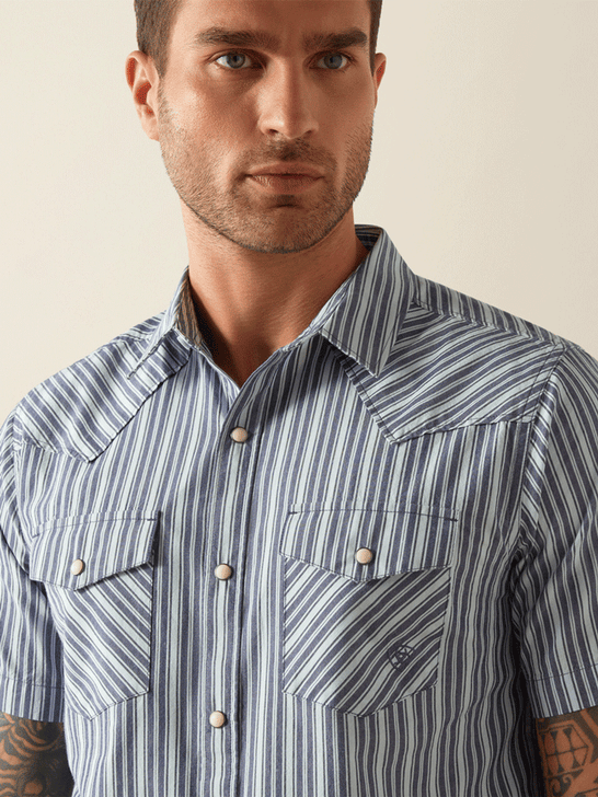 Ariat 10054700 Mens Hyder Retro Fit Short Sleeve Shirt Blue front close up. If you need any assistance with this item or the purchase of this item please call us at five six one seven four eight eight eight zero one Monday through Saturday 10:00a.m EST to 8:00 p.m EST