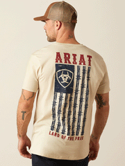 Ariat 10054001 Mens Barbed Flag T-Shirt Natural back. If you need any assistance with this item or the purchase of this item please call us at five six one seven four eight eight eight zero one Monday through Saturday 10:00a.m EST to 8:00 p.m EST