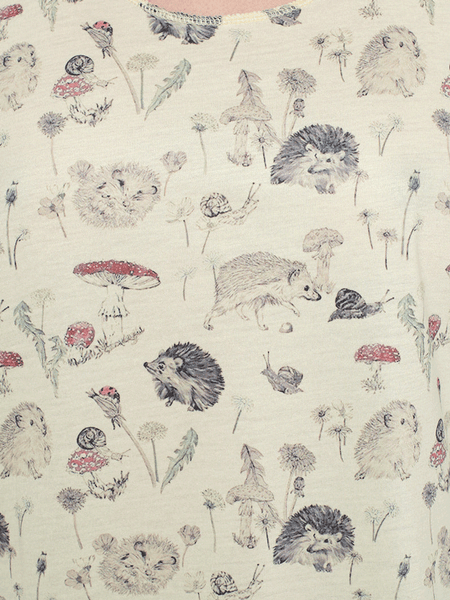 SM Wardrobe V981 Womens Hedgehog Floral Print Tank Top Cream fabric close up. If you need any assistance with this item or the purchase of this item please call us at five six one seven four eight eight eight zero one Monday through Saturday 10:00a.m EST to 8:00 p.m EST