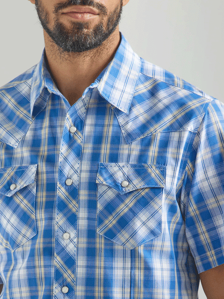 Wrangler 112324653 Mens Snap Short Sleeve Plaid Shirt Blue front close up. If you need any assistance with this item or the purchase of this item please call us at five six one seven four eight eight eight zero one Monday through Saturday 10:00a.m EST to 8:00 p.m EST