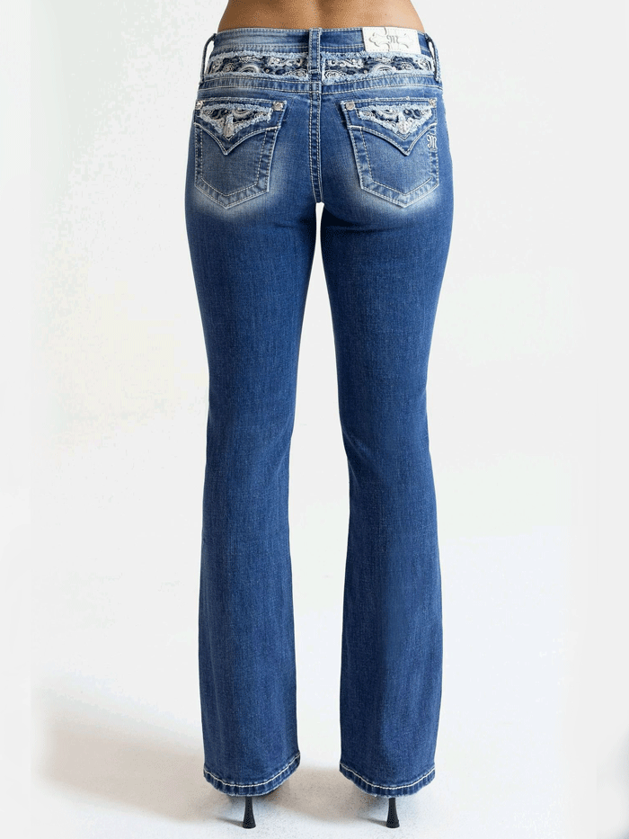 Miss Me M9368BV Womens Mid Rise Boot Jean Medium Blue back pocket close up. If you need any assistance with this item or the purchase of this item please call us at five six one seven four eight eight eight zero one Monday through Saturday 10:00a.m EST to 8:00 p.m EST

