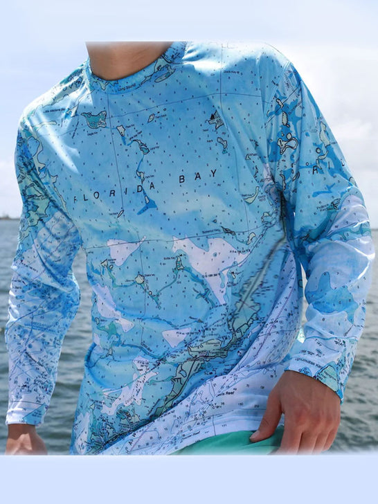 Shaka Kai THE KEYS Mens Long Sleeve Performance Shirt Light Blue front view. If you need any assistance with this item or the purchase of this item please call us at five six one seven four eight eight eight zero one Monday through Saturday 10:00a.m EST to 8:00 p.m EST