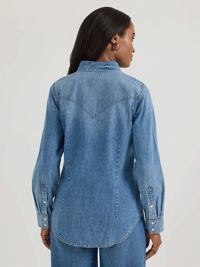 Wrangler 112360739 Womens Classic Denim Slim Western Snap Shirt Mid Wash front view. If you need any assistance with this item or the purchase of this item please call us at five six one seven four eight eight eight zero one Monday through Saturday 10:00a.m EST to 8:00 p.m EST