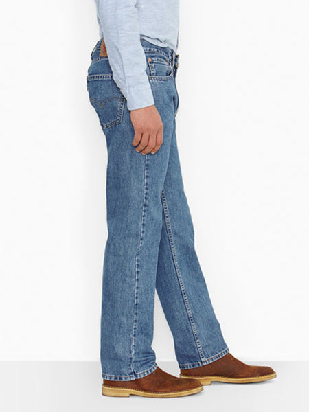 Levi’s 005054891 Mens 505 Regular Fit Jeans Medium Stonewash side view. If you need any assistance with this item or the purchase of this item please call us at five six one seven four eight eight eight zero one Monday through Saturday 10:00a.m EST to 8:00 p.m EST