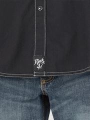 Wrangler 112317112 Mens Rock 47 Long Sleeve Embroidered Yoke Shirt Black Beauty rock 47 tag close up. If you need any assistance with this item or the purchase of this item please call us at five six one seven four eight eight eight zero one Monday through Saturday 10:00a.m EST to 8:00 p.m EST