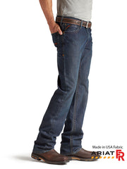 Ariat 10012555 Mens FR M4 Relaxed Basic Boot Cut Jean Shale side view. If you need any assistance with this item or the purchase of this item please call us at five six one seven four eight eight eight zero one Monday through Saturday 10:00a.m EST to 8:00 p.m EST