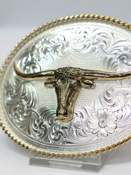 Montana Silversmiths 1350-767H Longhorn Engraved Buckle With Gold Rope Trim Silver close up. If you need any assistance with this item or the purchase of this item please call us at five six one seven four eight eight eight zero one Monday through Saturday 10:00a.m EST to 8:00 p.m EST