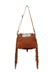 Myra Bag S-6220 Womens Blaze Handtooled Bag Brown back view hanging. If you need any assistance with this item or the purchase of this item please call us at five six one seven four eight eight eight zero one Monday through Saturday 10:00a.m EST to 8:00 p.m EST