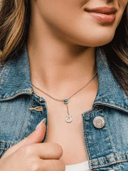 Montana Silversmiths NC5157 Womens Infinite Luck Turquoise Pendant Necklace Silver on model. If you need any assistance with this item or the purchase of this item please call us at five six one seven four eight eight eight zero one Monday through Saturday 10:00a.m EST to 8:00 p.m EST