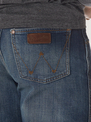 Wrangler WRT20JH Mens Retro Relaxed Fit Bootcut JH Wash back pocket close up. If you need any assistance with this item or the purchase of this item please call us at five six one seven four eight eight eight zero one Monday through Saturday 10:00a.m EST to 8:00 p.m EST