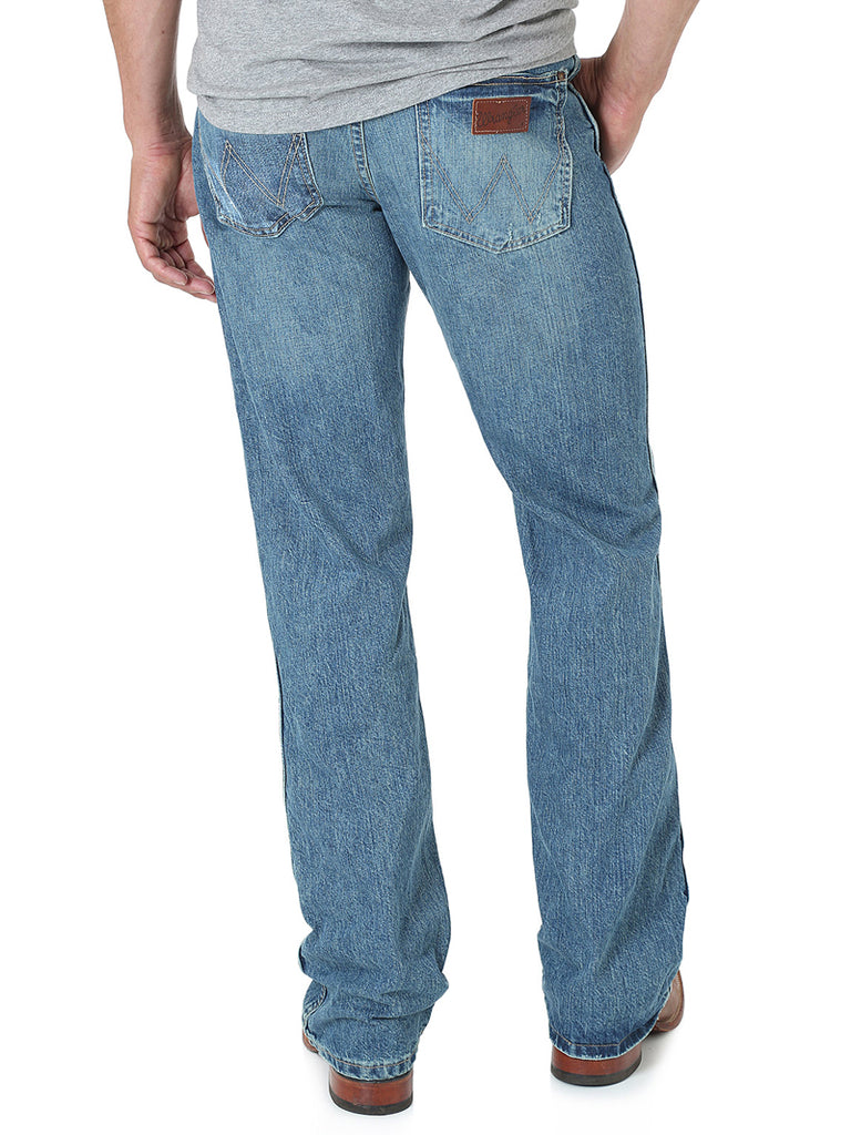 Wrangler 77MWZWO Mens Retro Jeans Slim Boot Worn front view. If you need any assistance with this item or the purchase of this item please call us at five six one seven four eight eight eight zero one Monday through Saturday 10:00a.m EST to 8:00 p.m EST