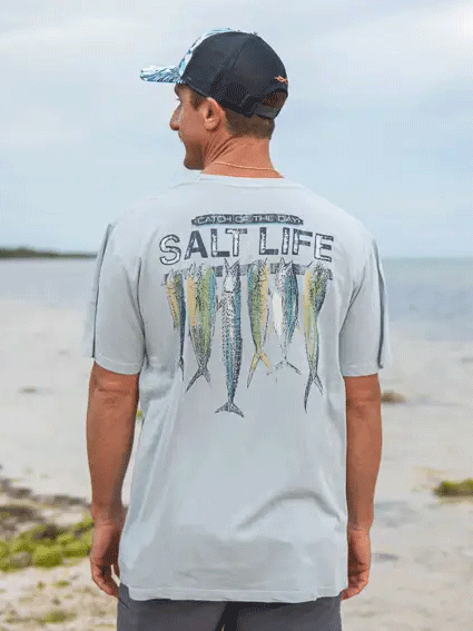 Salt Life SLM30213 Mens Stringer Salt Wash Fishing Pocket Tee Blue Fog back view on model. If you need any assistance with this item or the purchase of this item please call us at five six one seven four eight eight eight zero one Monday through Saturday 10:00a.m EST to 8:00 p.m EST