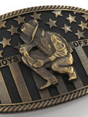 Montana Silversmiths A706C Cowboys of Faith Flag Buckle Brass close up. If you need any assistance with this item or the purchase of this item please call us at five six one seven four eight eight eight zero one Monday through Saturday 10:00a.m EST to 8:00 p.m EST