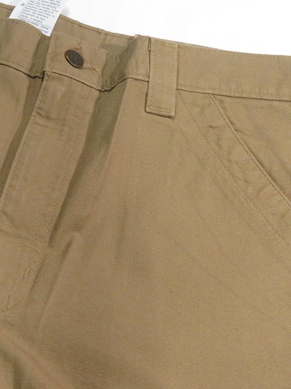 Carhartt B151 Mens Canvas Work Dungaree Pants Dark Khaki front view on model. If you need any assistance with this item or the purchase of this item please call us at five six one seven four eight eight eight zero one Monday through Saturday 10:00a.m EST to 8:00 p.m EST