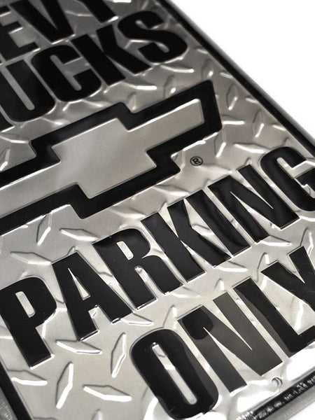 Chevy Trucks Parking Only 12x18 Metal Sign close up view. If you need any assistance with this item or the purchase of this item please call us at five six one seven four eight eight eight zero one Monday through Saturday 10:00a.m EST to 8:00 p.m EST