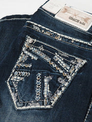 Grace in LA JB-51372 Womens Stitched Embellished Bootcut Jeans Dark Wash back pocket close up. If you need any assistance with this item or the purchase of this item please call us at five six one seven four eight eight eight zero one Monday through Saturday 10:00a.m EST to 8:00 p.m EST