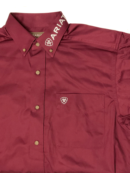 Ariat 10027995 Mens Team Logo Twill Classic Fit Shirt Burgundy collar and pocket detail. If you need any assistance with this item or the purchase of this item please call us at five six one seven four eight eight eight zero one Monday through Saturday 10:00a.m EST to 8:00 p.m EST