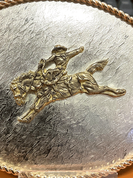Montana Silversmiths G6128-501 Saddle Bronc Buckle figure detail close up. If you need any assistance with this item or the purchase of this item please call us at five six one seven four eight eight eight zero one Monday through Saturday 10:00a.m EST to 8:00 p.m EST