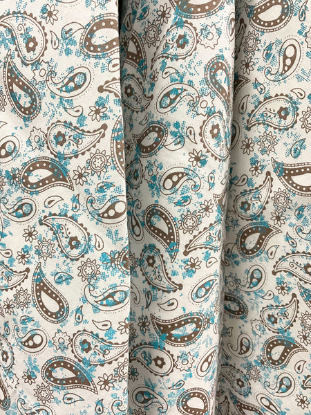 Wrangler 112314967 Mens 20X Competition Advanced Comfort Shirt Turquoise And Brown fabric close up. If you need any assistance with this item or the purchase of this item please call us at five six one seven four eight eight eight zero one Monday through Saturday 10:00a.m EST to 8:00 p.m EST