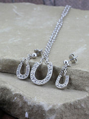 Montana Silversmiths JS808 Lucky Horseshoe Rhinestone Jewelry Set on the stone Crystal Clear Lucky Horseshoe Jewelry Set. If you need any assistance with this item or the purchase of this item please call us at five six one seven four eight eight eight zero one Monday through Saturday 10:00a.m EST to 8:00 p.m EST