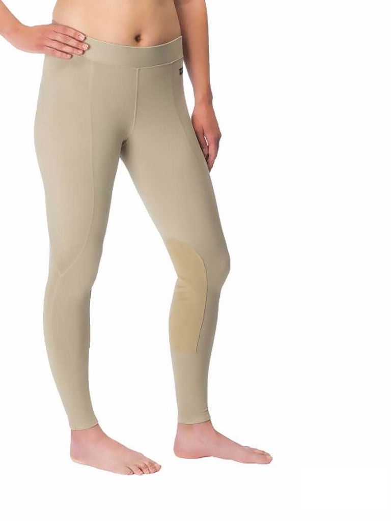 Kerrits 50200 Womens Flow Rise Knee Patch Performance Tight Black or Tan. If you need any assistance with this item or the purchase of this item please call us at five six one seven four eight eight eight zero one Monday through Saturday 10:00a.m EST to 8:00 p.m EST