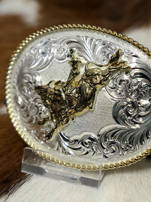Montana Silversmiths 1340-528 Bull Rider Gold Rope Trimmed Engraved Buckle Silver front view. If you need any assistance with this item or the purchase of this item please call us at five six one seven four eight eight eight zero one Monday through Saturday 10:00a.m EST to 8:00 p.m EST