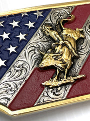 Montana Silversmiths A865 Mens Patriot Bull Rider Attitude Belt Buckle close up. If you need any assistance with this item or the purchase of this item please call us at five six one seven four eight eight eight zero one Monday through Saturday 10:00a.m EST to 8:00 p.m EST
