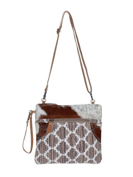 Myra Bag S-3306 Womens Iconic Statement Small & Crossbody Bag front view hanging. If you need any assistance with this item or the purchase of this item please call us at five six one seven four eight eight eight zero one Monday through Saturday 10:00a.m EST to 8:00 p.m EST