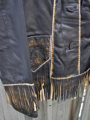 Scully L727-259 Fringe And Tooled Details Western Leather Jacket Brown cuff close up. If you need any assistance with this item or the purchase of this item please call us at five six one seven four eight eight eight zero one Monday through Saturday 10:00a.m EST to 8:00 p.m EST