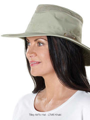 Tilley LTM6-KHOL Airflo Hat Khaki front and side view on female model. If you need any assistance with this item or the purchase of this item please call us at five six one seven four eight eight eight zero one Monday through Saturday 10:00a.m EST to 8:00 p.m EST