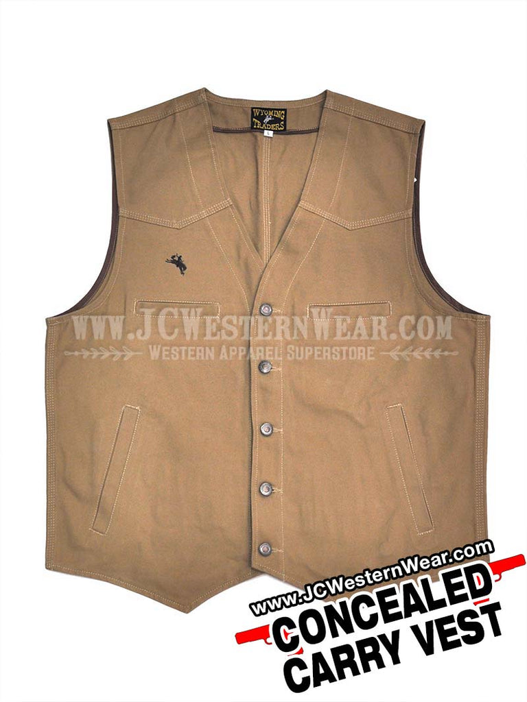 Wyoming Traders TEXAS Mens Concealed Carry Vest Tan on model. If you need any assistance with this item or the purchase of this item please call us at five six one seven four eight eight eight zero one Monday through Saturday 10:00a.m EST to 8:00 p.m EST