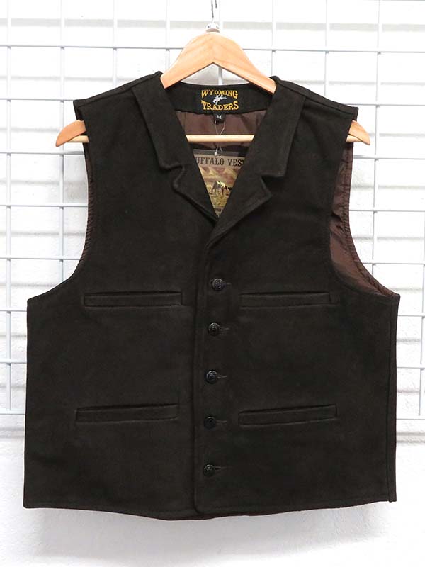 Wyoming Traders Mens Buffalo Leather Vests Chocolate front view hanging. If you need any assistance with this item or the purchase of this item please call us at five six one seven four eight eight eight zero one Monday through Saturday 10:00a.m EST to 8:00 p.m EST