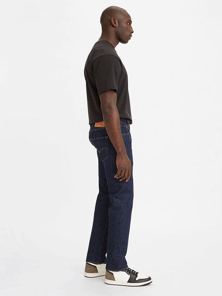 Levi’s 005010115 Mens 501 Original Fit Jeans Rinse Dark Wash side view. If you need any assistance with this item or the purchase of this item please call us at five six one seven four eight eight eight zero one Monday through Saturday 10:00a.m EST to 8:00 p.m EST