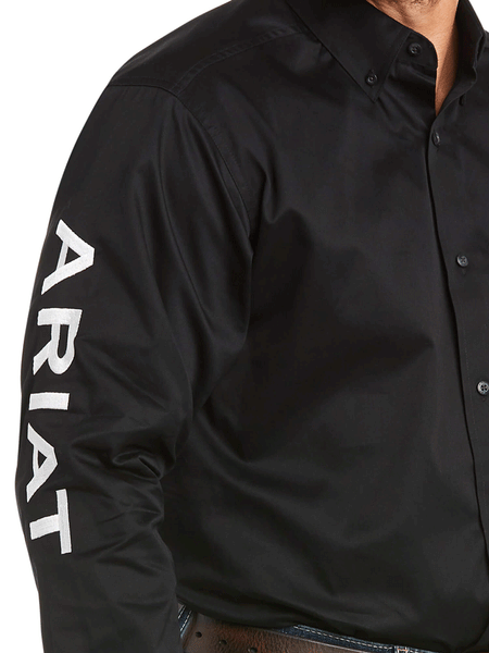 Ariat 10017497 Mens Team Logo Twill Classic Fit Shirt Black arm close up. If you need any assistance with this item or the purchase of this item please call us at five six one seven four eight eight eight zero one Monday through Saturday 10:00a.m EST to 8:00 p.m EST