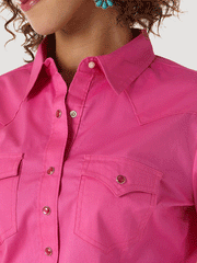 Wrangler LW1003K Ladies Western Long Sleeve Solid Shirt Pink front close up  If you need any assistance with this item or the purchase of this item please call us at five six one seven four eight eight eight zero one Monday through Satuday 10:00 a.m. EST to 8:00 p.m. EST