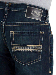 Ariat 10043189 Mens M5 Straight Winfield Straight Jean Roadhouse back pocket close up. If you need any assistance with this item or the purchase of this item please call us at five six one seven four eight eight eight zero one Monday through Saturday 10:00a.m EST to 8:00 p.m EST