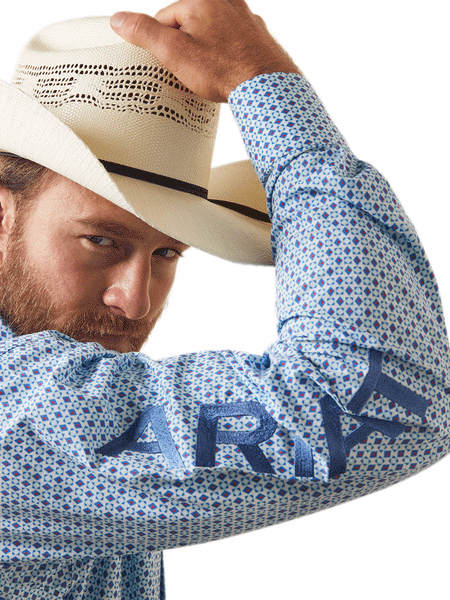 Ariat 10043854 Mens Team Syed Fitted Long Sleeve Shirt White arm logo cloce up. If you need any assistance with this item or the purchase of this item please call us at five six one seven four eight eight eight zero one Monday through Saturday 10:00a.m EST to 8:00 p.m EST