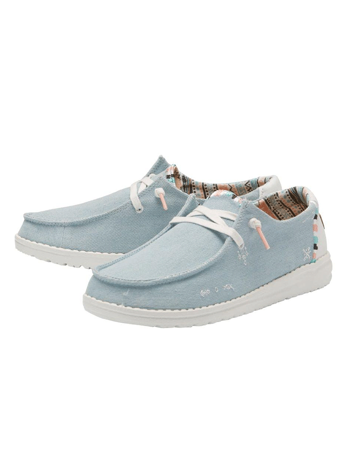 Hey Dude 121412412 Womens Wendy Boho Shoe Light Denim front and sole view. If you need any assistance with this item or the purchase of this item please call us at five six one seven four eight eight eight zero one Monday through Saturday 10:00a.m EST to 8:00 p.m EST