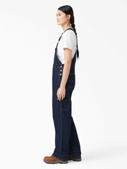 Dickies FB206DIB Womens Relaxed Fit Bib Overalls Dark Indigo side view. If you need any assistance with this item or the purchase of this item please call us at five six one seven four eight eight eight zero one Monday through Saturday 10:00a.m EST to 8:00 p.m EST