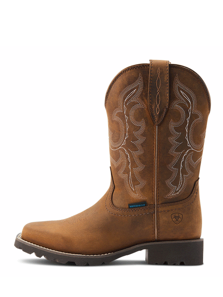 Ariat 10044437 Womens Unbridled Rancher H2O Oily Distressed Tan outter side view. If you need any assistance with this item or the purchase of this item please call us at five six one seven four eight eight eight zero one Monday through Saturday 10:00a.m EST to 8:00 p.m EST