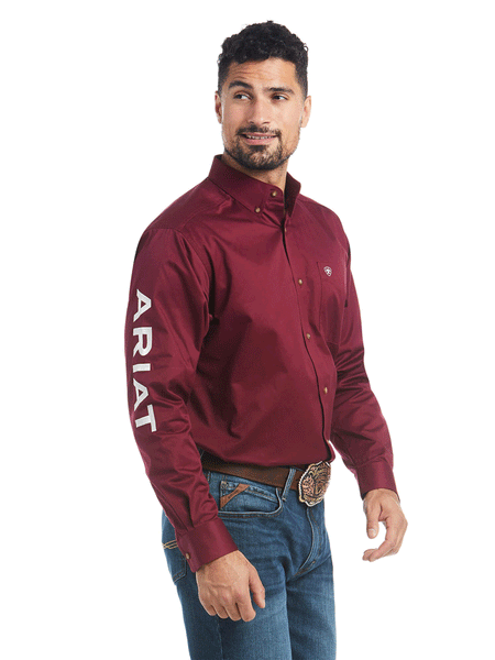 Ariat 10027995 Mens Team Logo Twill Classic Fit Shirt Burgundy front and side view. If you need any assistance with this item or the purchase of this item please call us at five six one seven four eight eight eight zero one Monday through Saturday 10:00a.m EST to 8:00 p.m EST