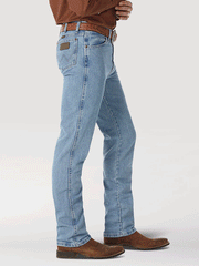 Wrangler 0936ATW Mens Cowboy Cut Slim Fit Jeans Antique Wash side view. If you need any assistance with this item or the purchase of this item please call us at five six one seven four eight eight eight zero one Monday through Saturday 10:00a.m EST to 8:00 p.m EST