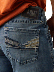 Ariat 10043185 Mens M8 Modern Williams Slim Leg Jean Dakota back pocket close up. If you need any assistance with this item or the purchase of this item please call us at five six one seven four eight eight eight zero one Monday through Saturday 10:00a.m EST to 8:00 p.m EST
