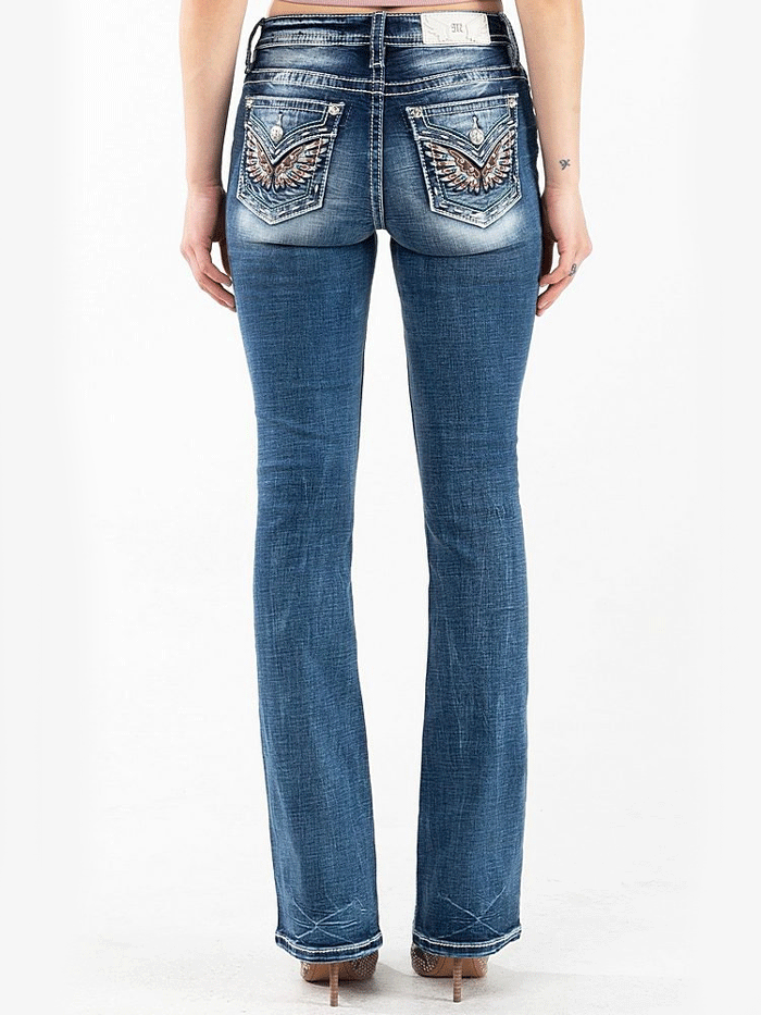 Miss Me M3080B33 Womens Mid-Rise Embroidered Wing Bootcut Jeans Vintage Blue back pocket close up. If you need any assistance with this item or the purchase of this item please call us at five six one seven four eight eight eight zero one Monday through Saturday 10:00a.m EST to 8:00 p.m EST