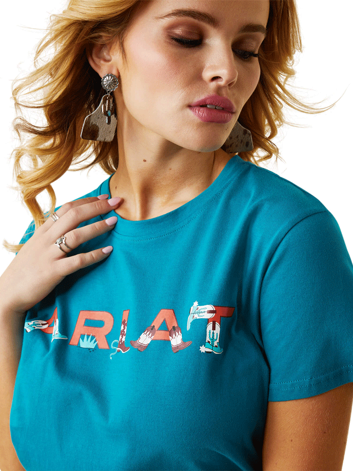 Ariat 10043632 Womens REAL Boot Kickin' Logo Tee Exotic Plume front view. If you need any assistance with this item or the purchase of this item please call us at five six one seven four eight eight eight zero one Monday through Saturday 10:00a.m EST to 8:00 p.m EST